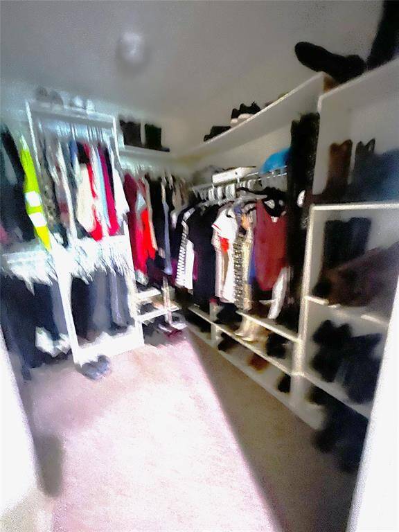 Large walk-in closet in Primary Bedroom