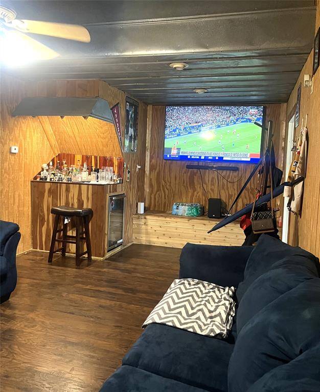 Den/Gameroom with wood paneling