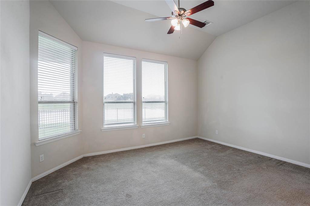 Beautiful views of lake from large primary bedroom.