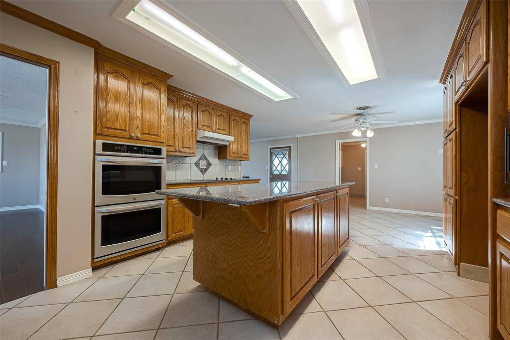 Double oven & doorway to dining room