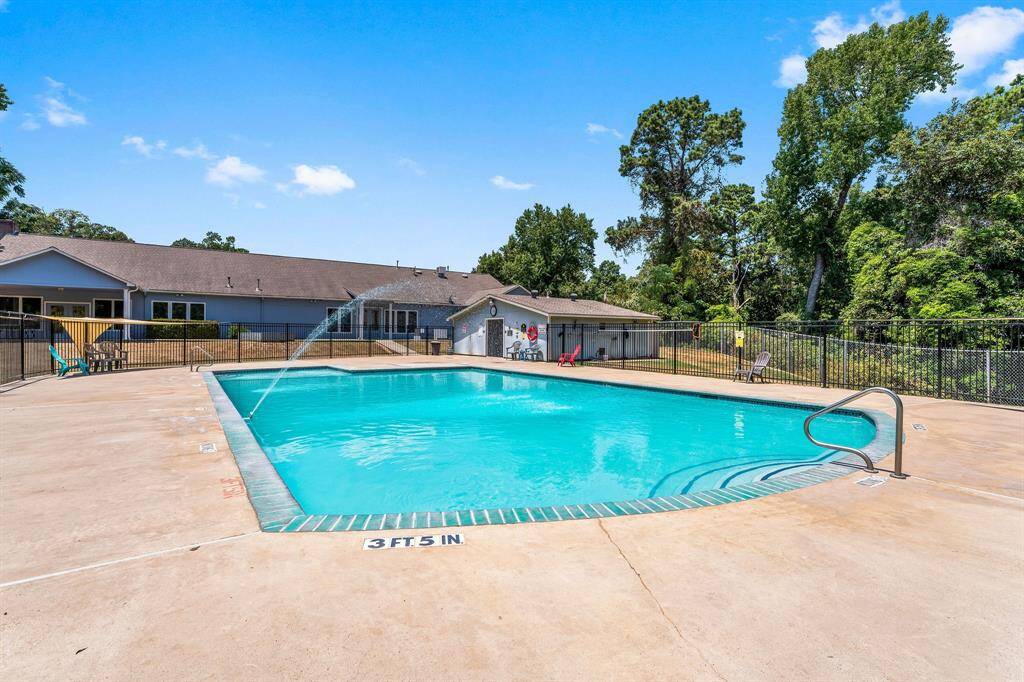 The pool is located behind the clubhouse