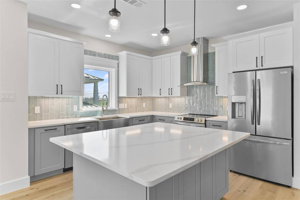 Entertain and create culinary delights around the expansive quartz island.