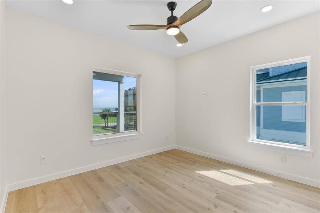 The first of the three additional guest bedrooms is located on the first level.