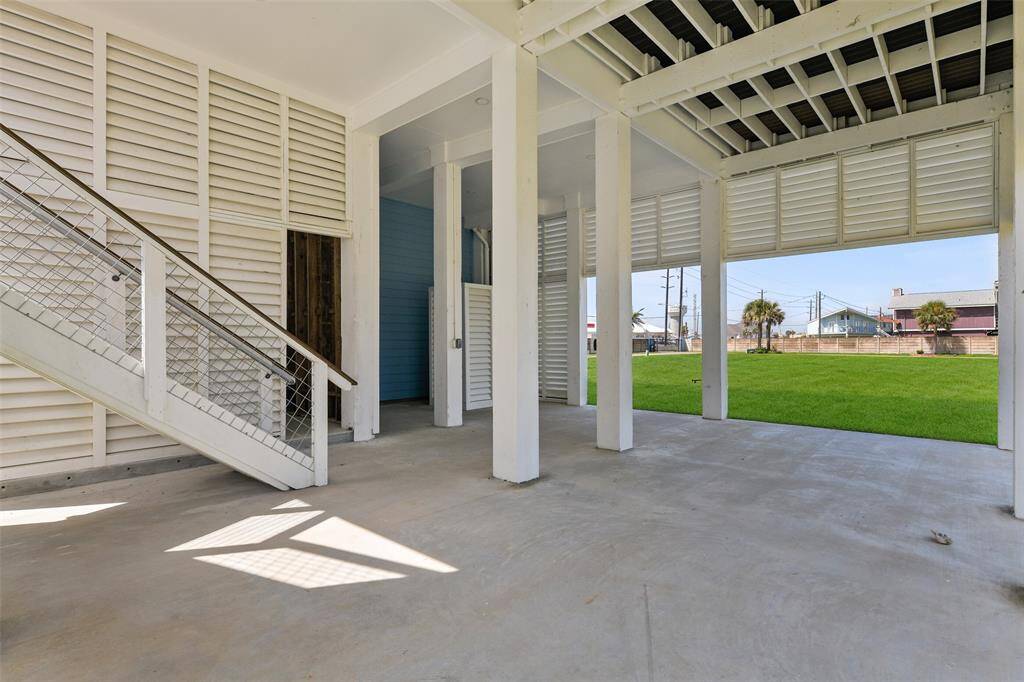 Experience the ultimate relaxation and entertainment in this open-air lower level, perfect for enjoying tranquil naps, feeling the refreshing coastal breeze, and hosting unforgettable barbecues.