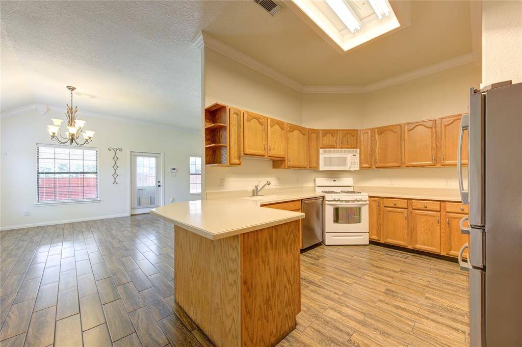 The kitchen has abundant cabinet space with soft-close drawers.