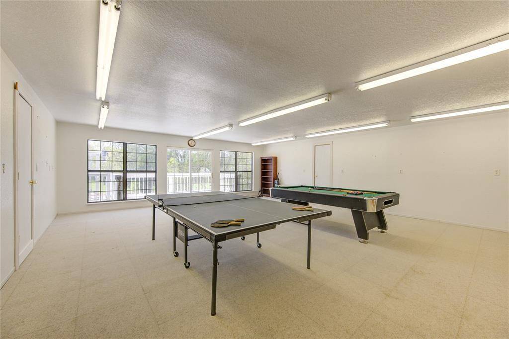 Game room w/ pool/ping pong table.