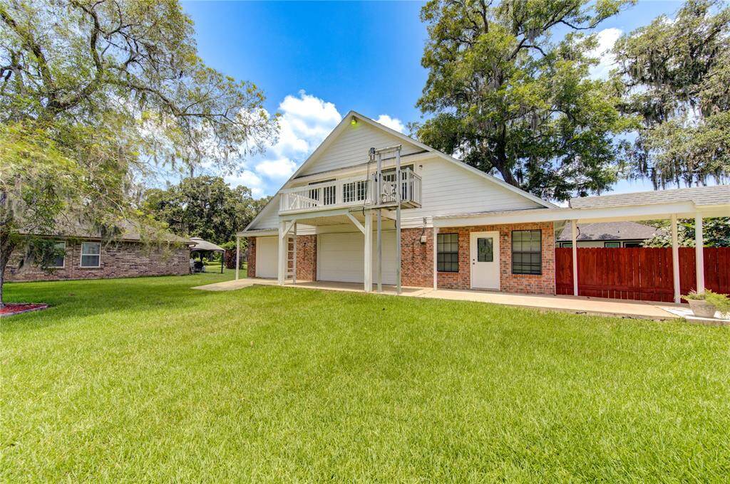 Two-story shop/garage area featuring automatic lift to balcony/upstairs game room.