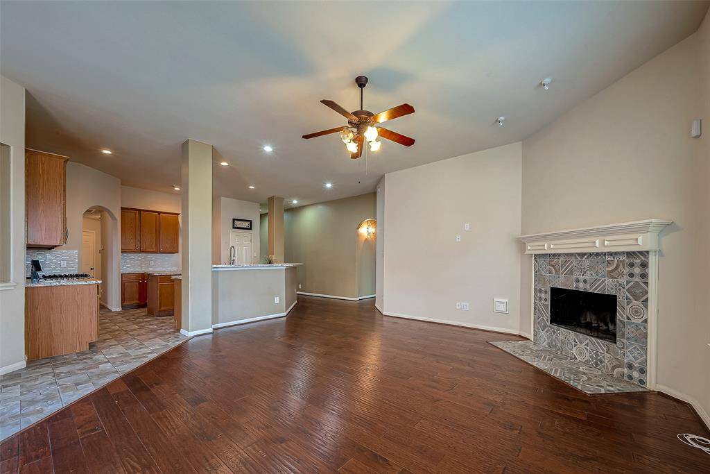 Cozy up to the custom fireplace with high-end tile.