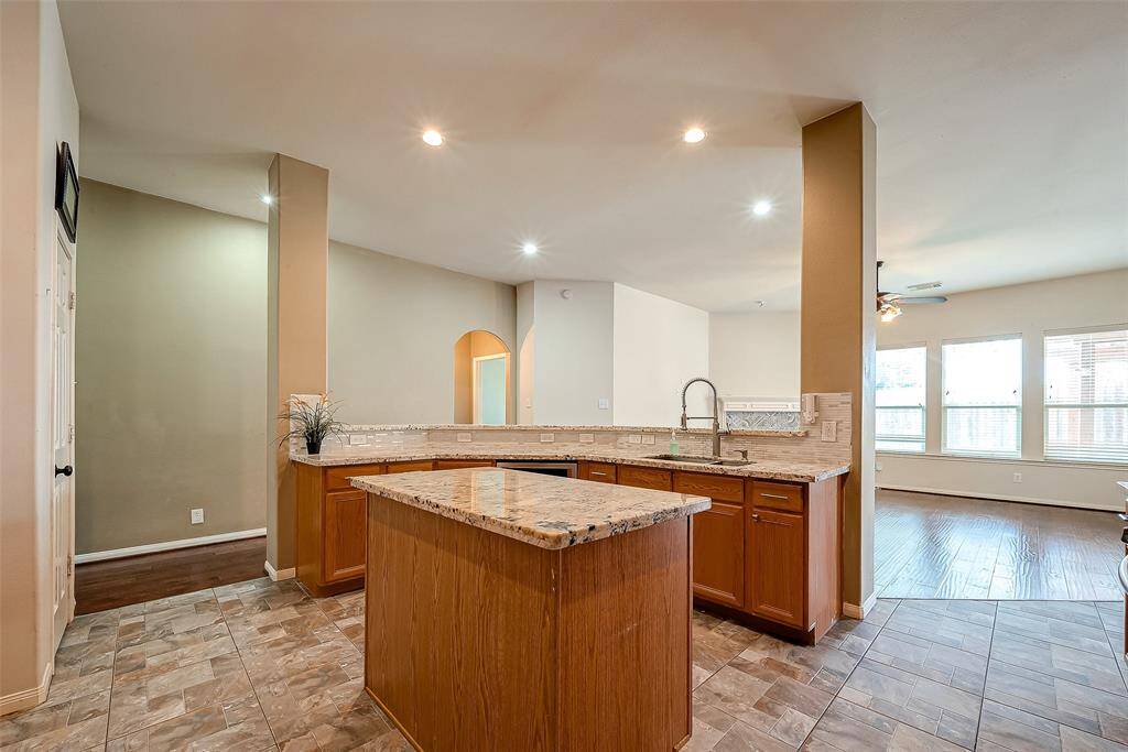 Ideal for entertaining, this kitchen has loads of counterspace and opens to the family room.