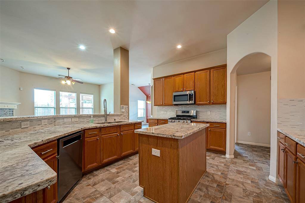 Upgraded Spanish tile in kitchen and bathrooms.