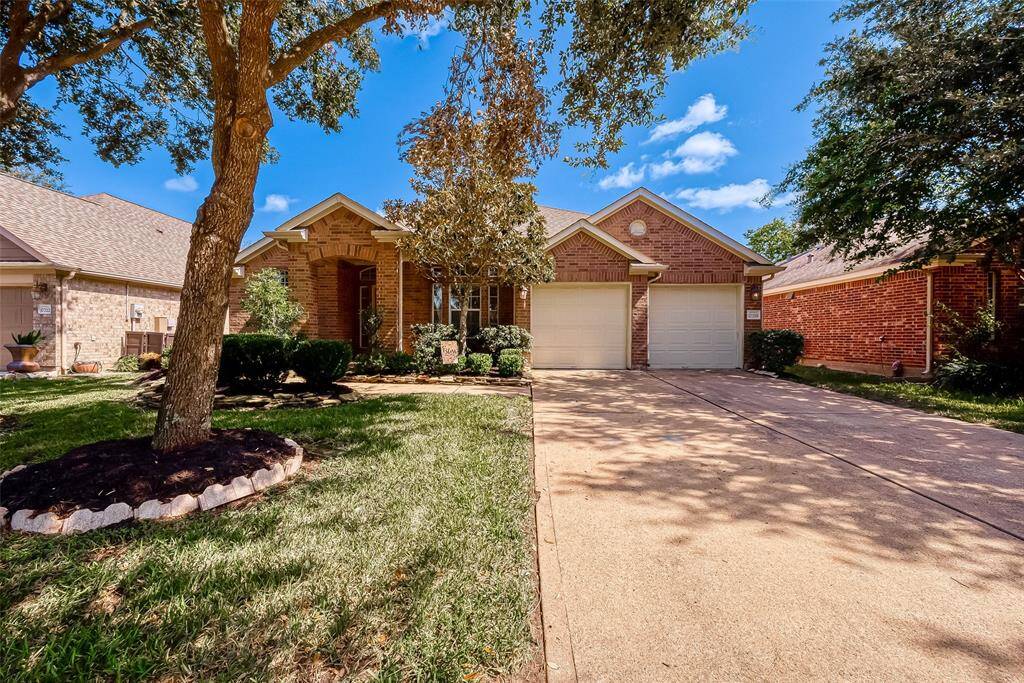 Brick front elevation and landscaped bed give this house great curb appeal!