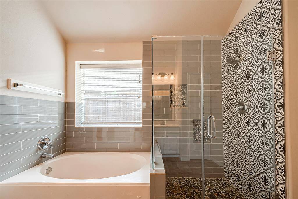 Look at these beautiful details in the upgraded tile and frameless shower.