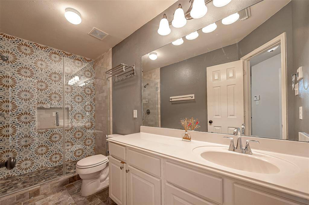 This is the updated guest bathroom in hallway, which is shared by secondary bedrooms.