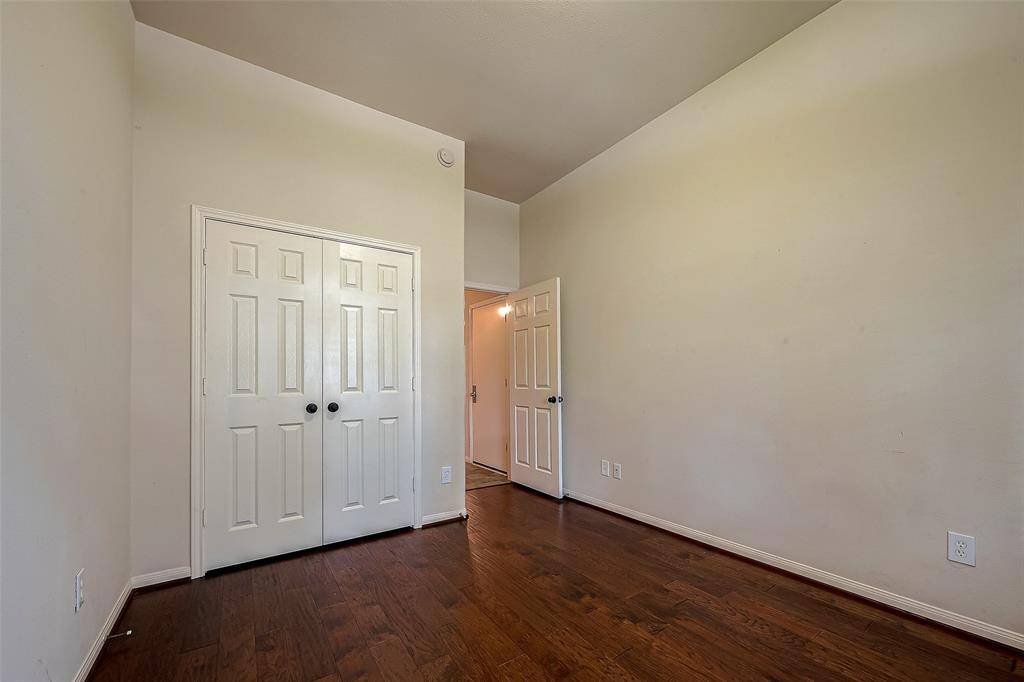 Third secondary bedroom toward front of house, it was used as an office but has a closet with double doors.