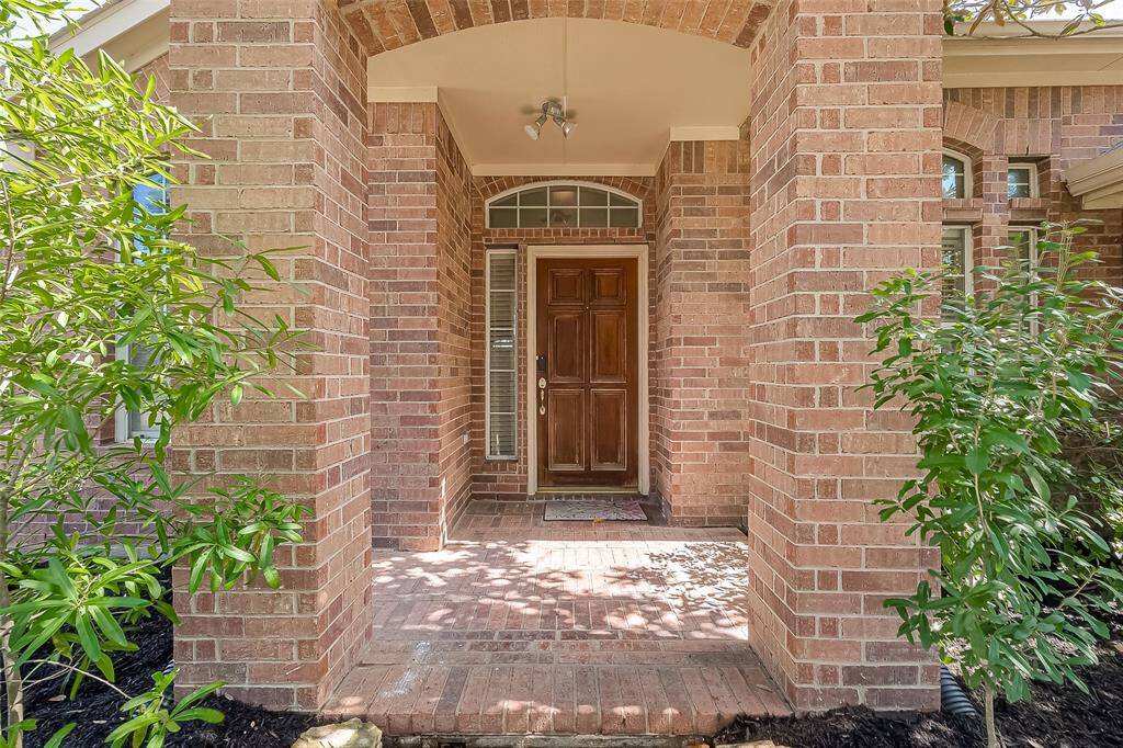 Covered front entrance invites guests in.