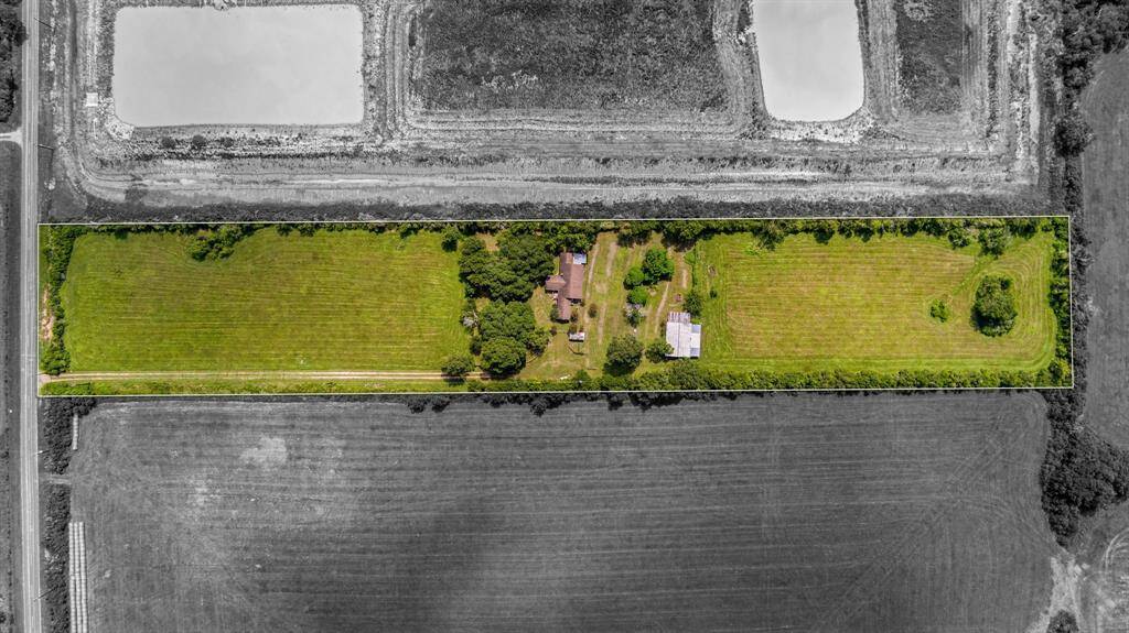 There is another building towards the back of the property.