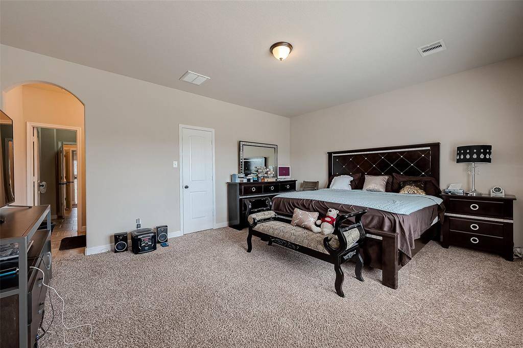 Secondary bedroom upstairs compares in size to the primary bedroom.  Also has a large walk-in closet.