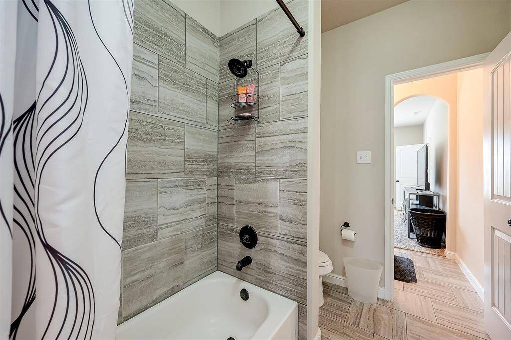 Shower/tub in Jack and Jill bath. Stylish tile and fixtures.