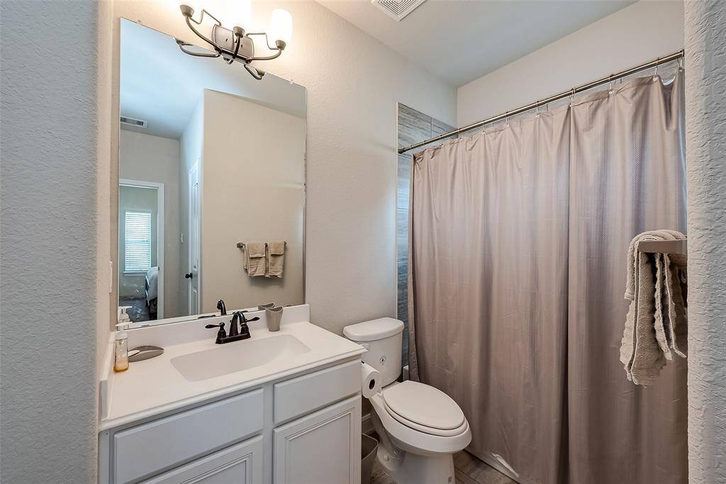 Third full bath! This is adjacent to the fifth bedroom.