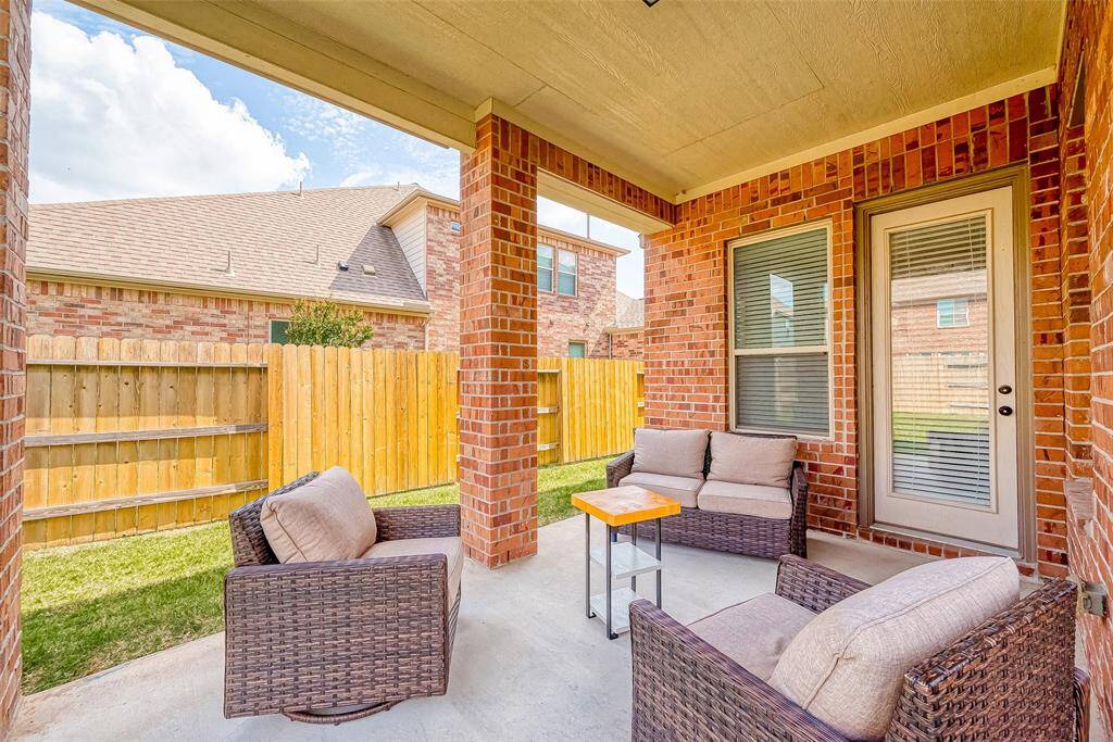 Covered patio space is perfect for entertaining or relaxing after work.