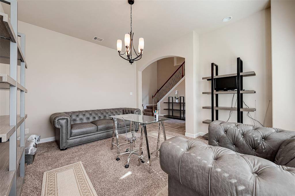 High ceilings and arches create an elegant impression upon entering home.
