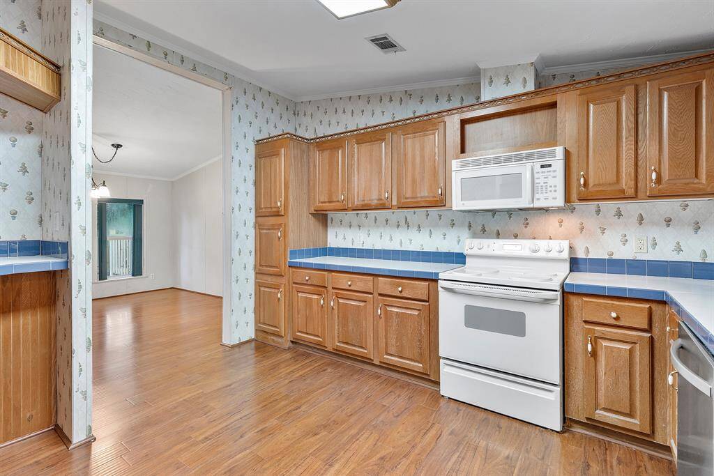 Plenty of counter space and cabinets here!