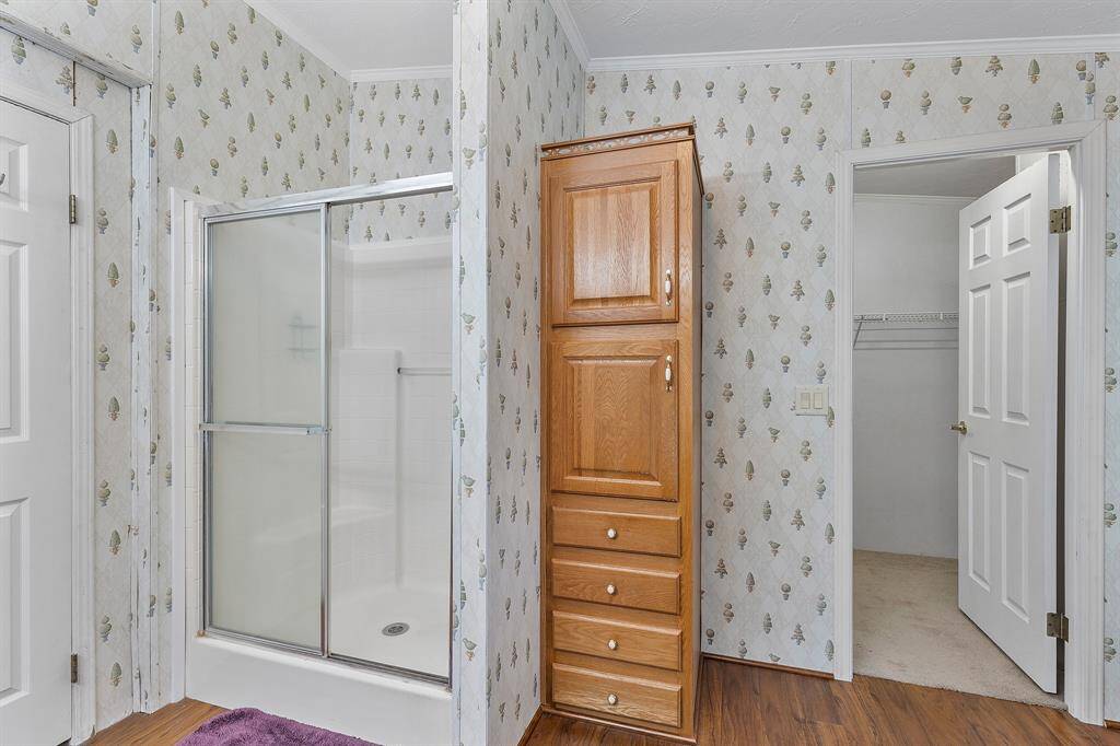 Separate shower and linen storage
