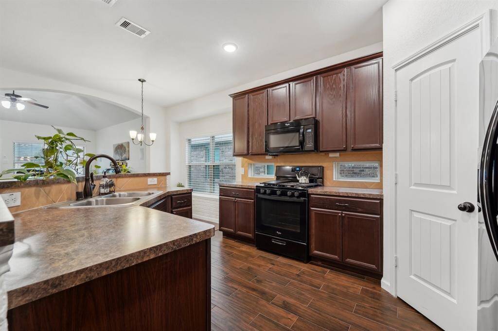 Kitchen is open to dining and family rooms