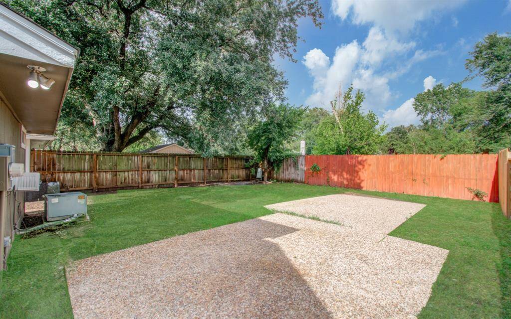 Spacious fenced backyard perfect for relaxation and play.