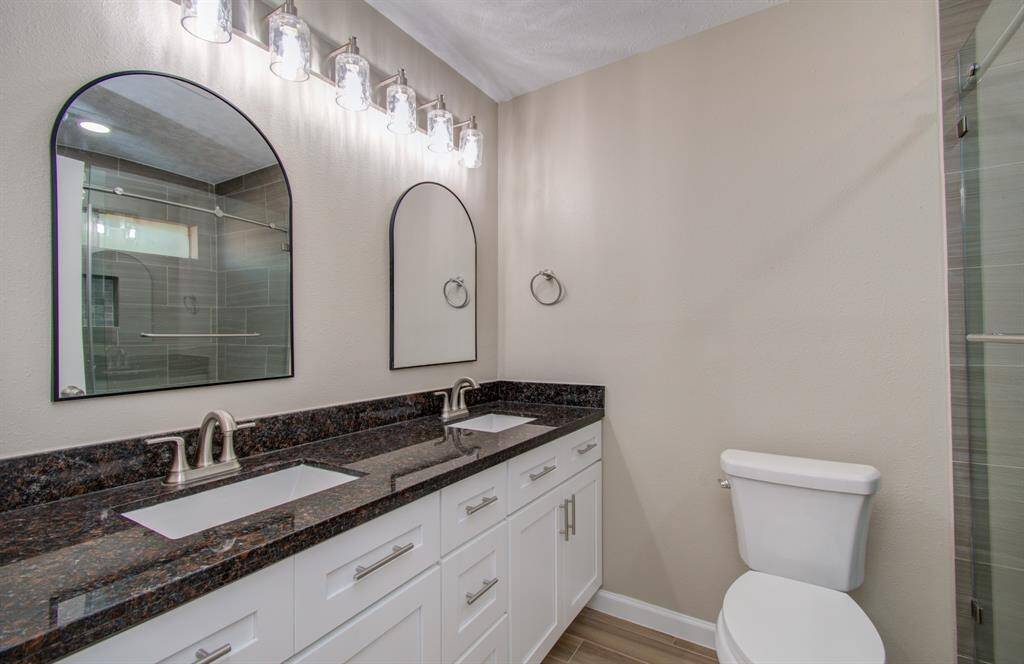 Spacious master bathroom featuring a luxurious walk-in shower.