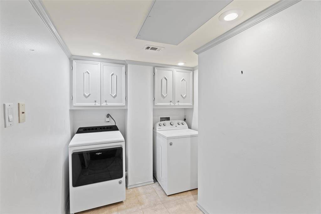 Utility room in unit with plenty of space for storage.