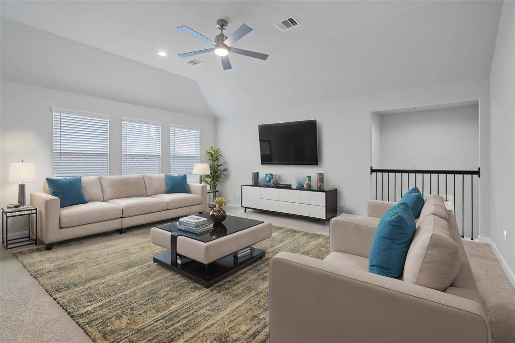 Come upstairs and enjoy a day of leisure in this fabulous game room! This is the perfect hangout spot or adult game room, this space features plush carpet, high ceiling, recessed lighting, ceiling fan, custom paint and large windows with privacy blinds.
