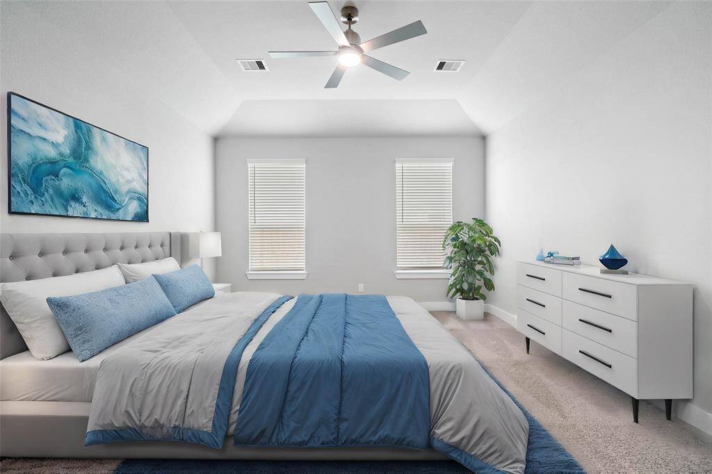 Come and unwind after a long day in this magnificent primary suite! This spacious room features plush carpet, warm paint, high ceilings with ceiling fan and large windows with privacy blinds.
