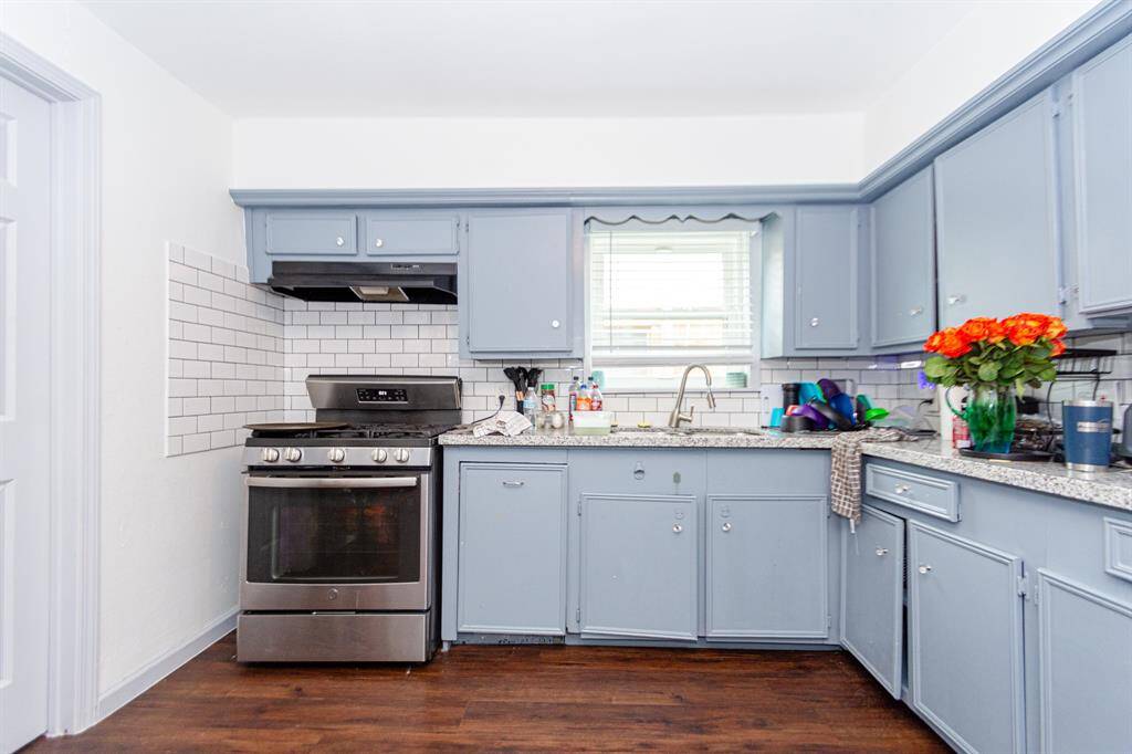 Large kitchen with tons of storage space with granite counter tops.
