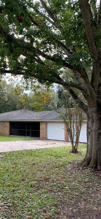Garage entrance and driveway are located on Ling Lane.