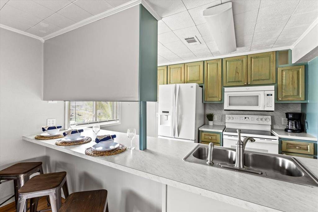 Kitchen with eat in bar.