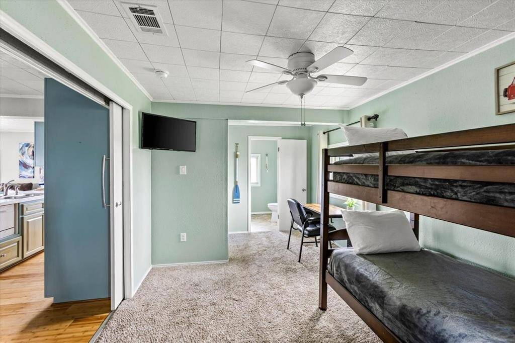 Flex space. Currently used for extra sleeping area. Also, has a desk and laundry room.