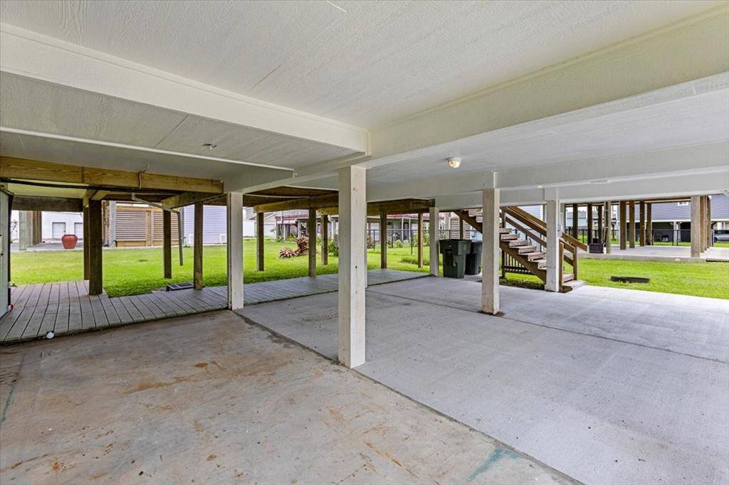 Underneath the home you'll find a garage and additional storage area for all your beach toys and surf boards!