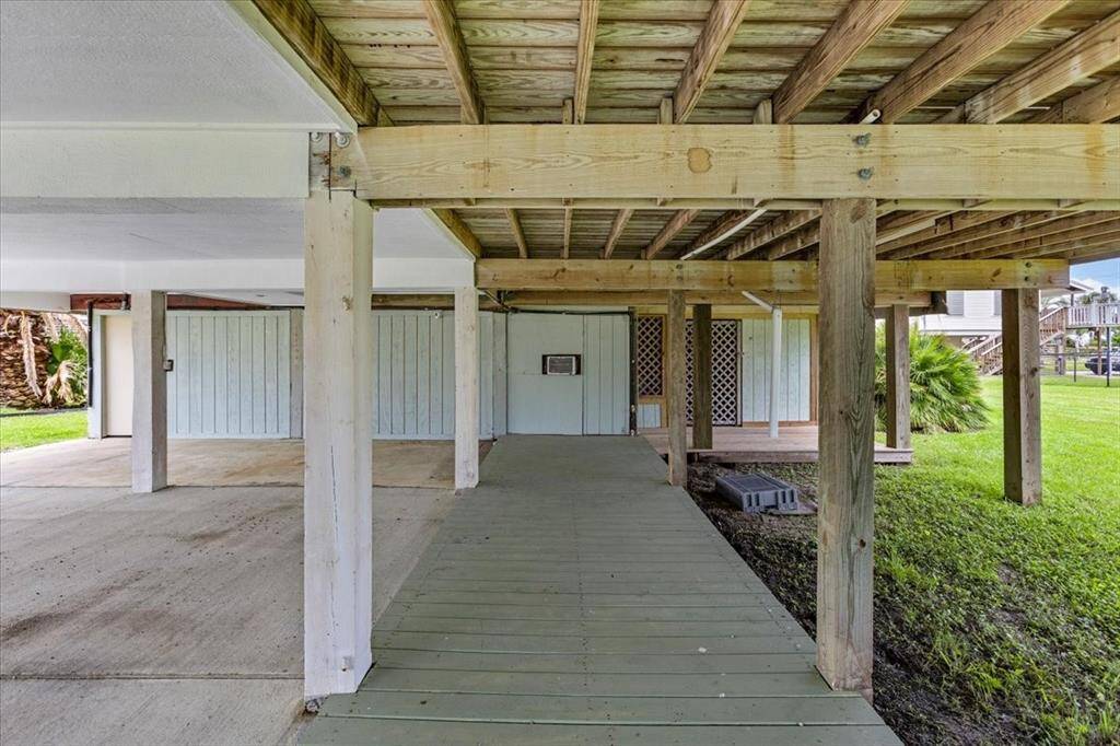 Underneath the home you'll find a garage and additional storage area for all your beach toys and surf boards!