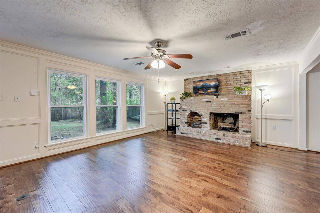 Grand space with family room open to kitchen area