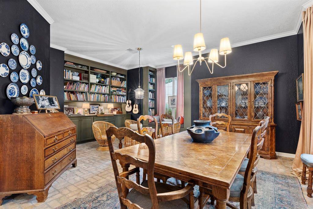 Formal dining with sitting area/library area.