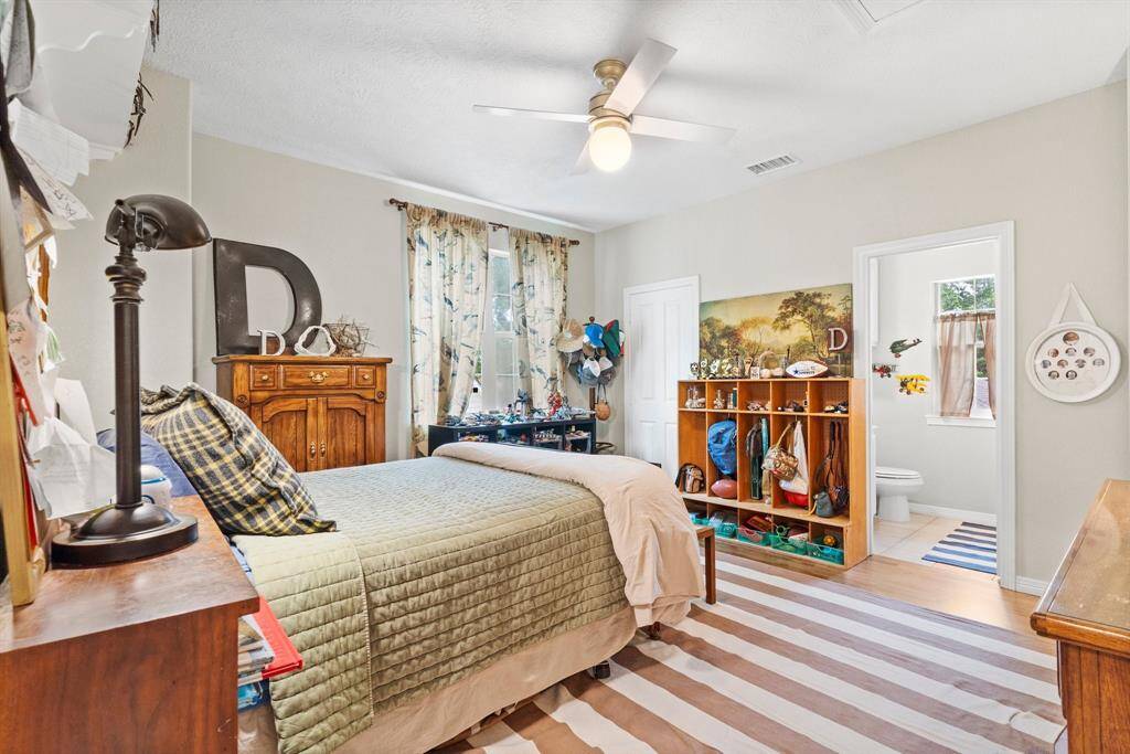 Secondary bedroom upstairs with attached bathroom.