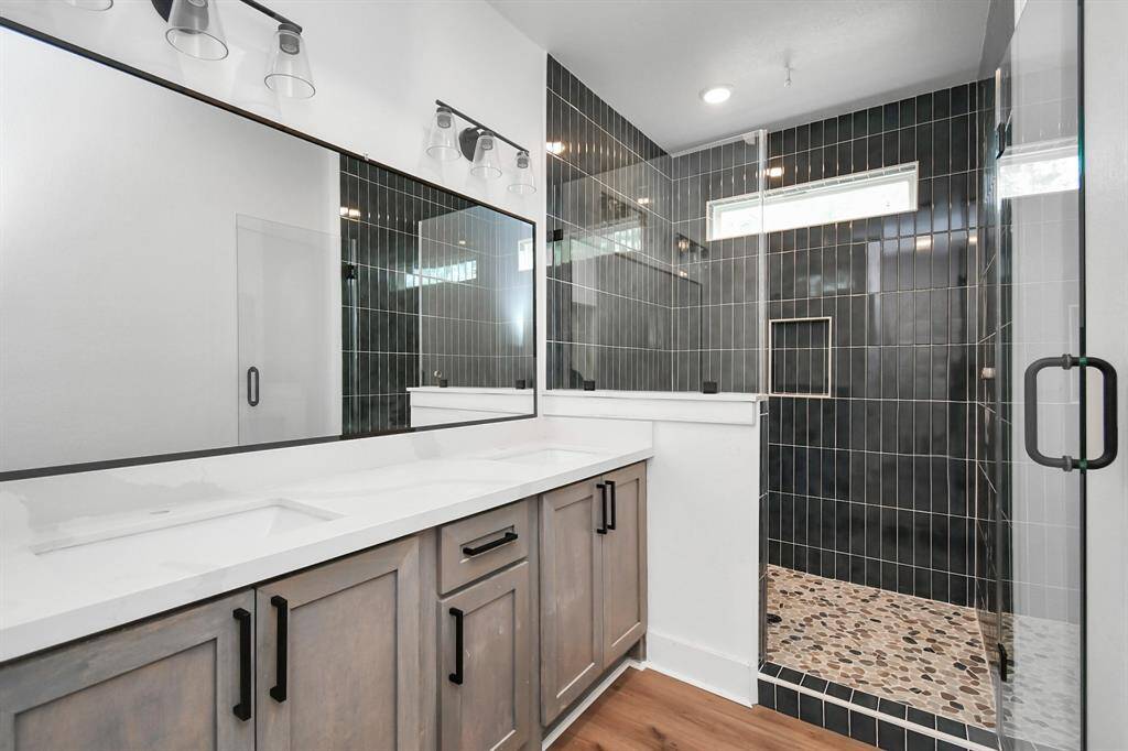 Primary bathroom/ blue tiled shower.