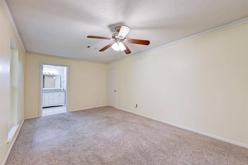 Primary bedroom/flex space downstairs with a full bath.