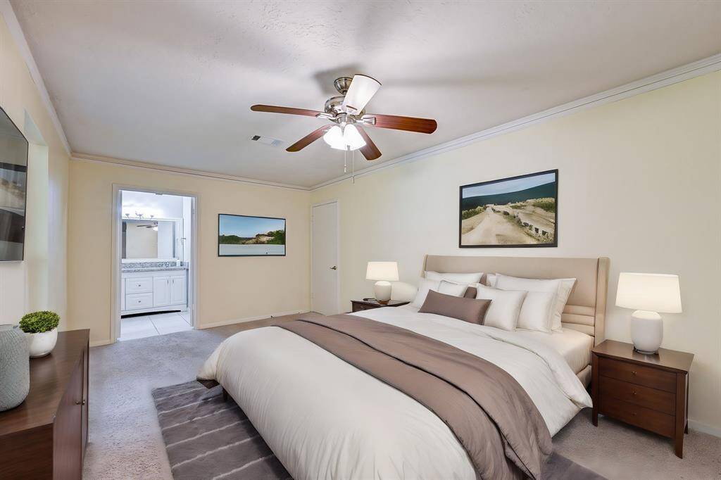 Primary bedroom/flex space downstairs with virtual staging