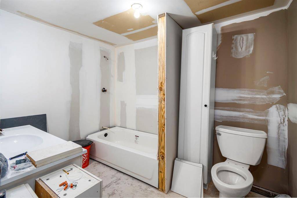 partially completed 1-bedroom, 1-bathroom apartment attached, providing extra living space or the potential for rental income