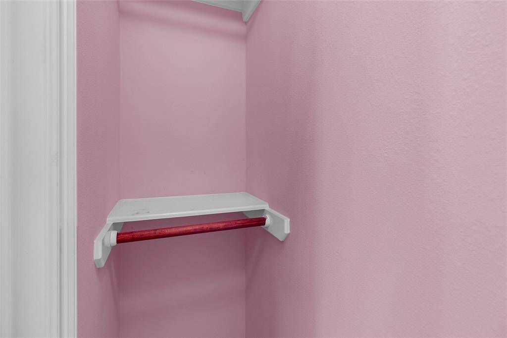 Pretty painted nook providing a quaint space for storage or display.