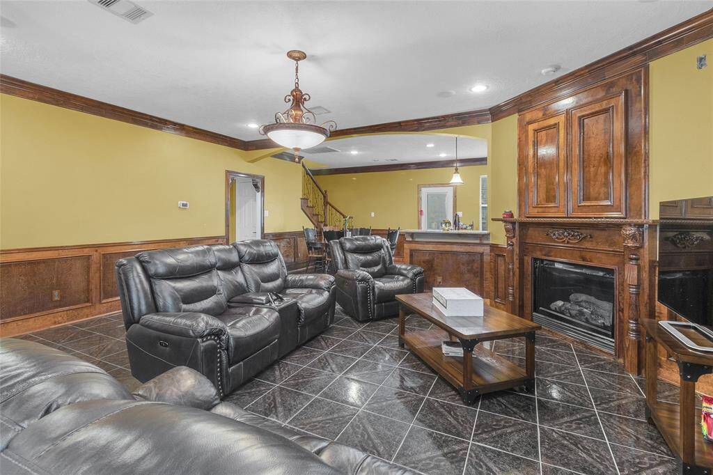 Inviting living space with elegant wood detailing and cozy fireplace perfect for relaxation and entertaining.