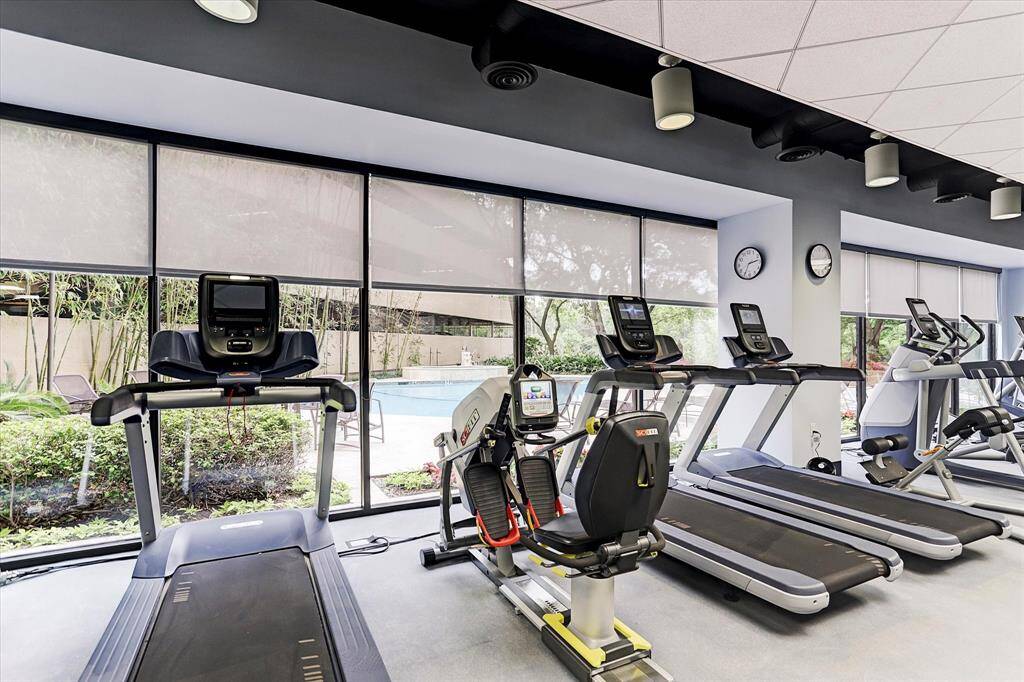 Modern gym with extensive weight area available.