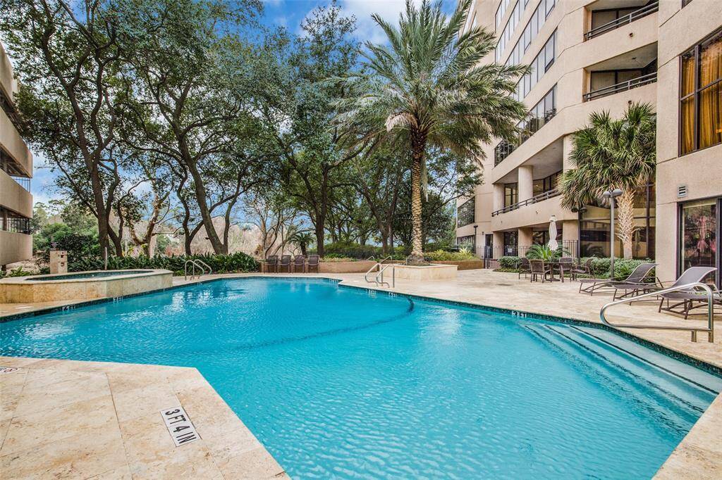 Indulge in a serene oasis with a luxurious saltwater pool and inviting hot tub.